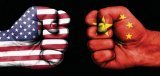 Composite image of fists with the U.S. and Chinese flag on the overlay.