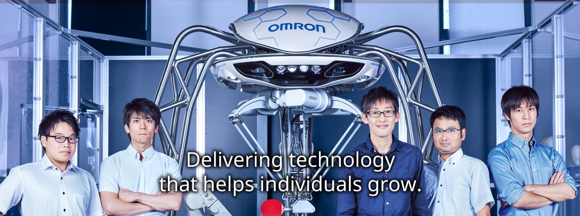 Omron banner image with staff and equipment.